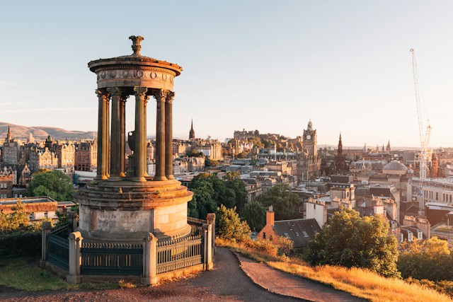 Edinburgh skyline from Calton Hill with the Dugald Stewart Monument at sunrise, home to Christmas party venues