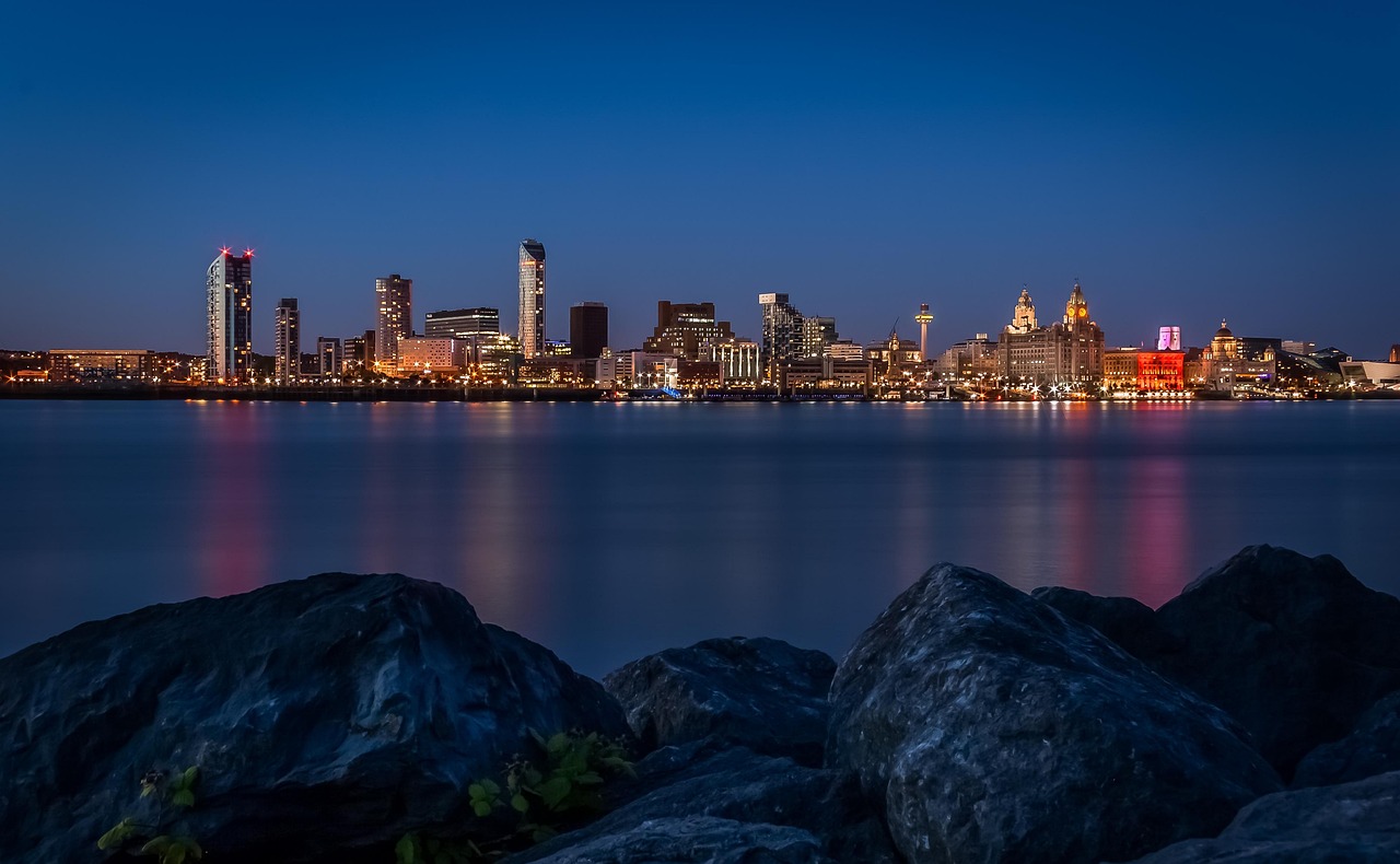 Liverpool waterfront skyline with the Royal Liver Building at night, home to Christmas party venues