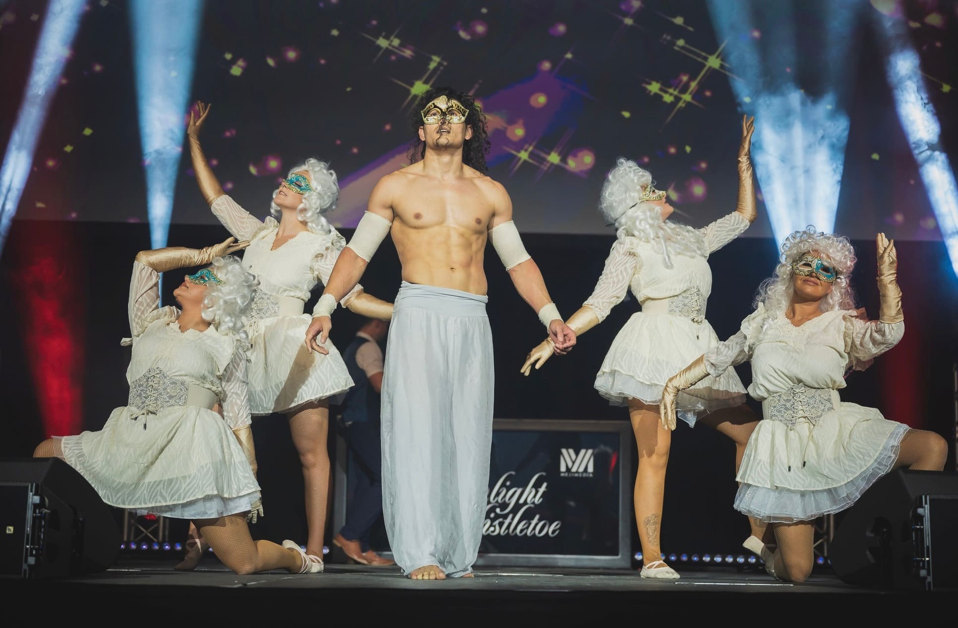 Masked stage performers at Moonlight & Mistletoe Winter Masquerade, ICB Wolverhampton