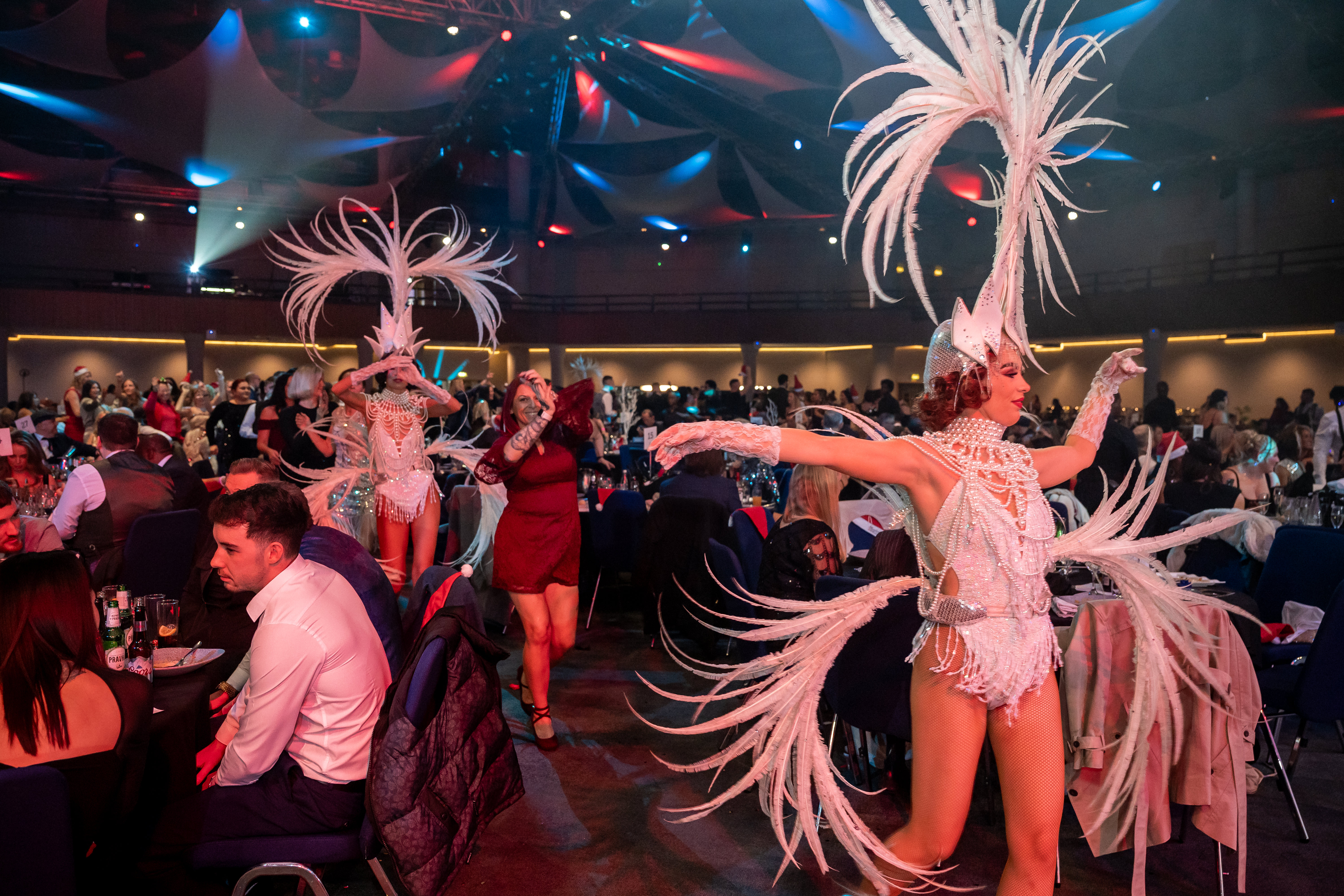 Live entertainment performers at a Christmas party night at the ICC Birmingham &mdash; showgirls dancing between tables