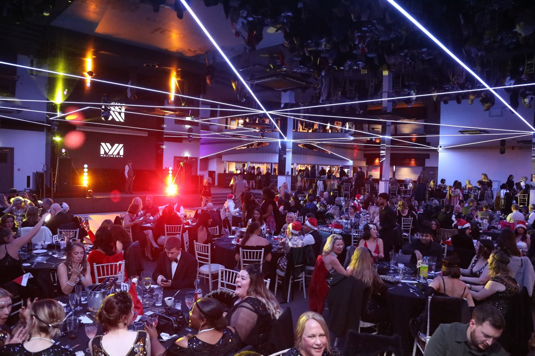 Christmas party night at the ICB Wolverhampton &mdash; full room of guests at tables with production laser lighting and live entertainment