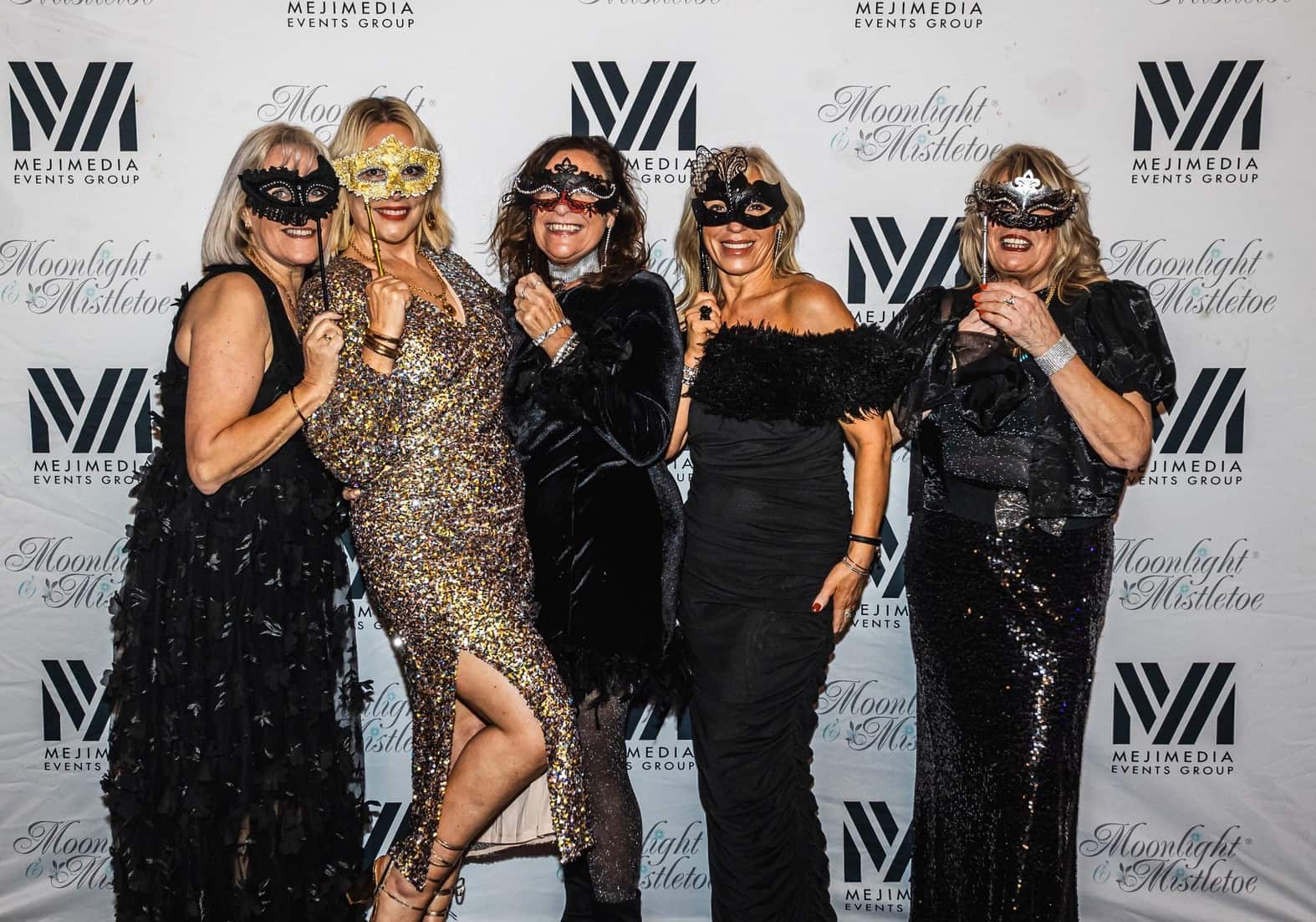 Guests in masquerade masks at Moonlight & Mistletoe Winter Masquerade, ICB Wolverhampton