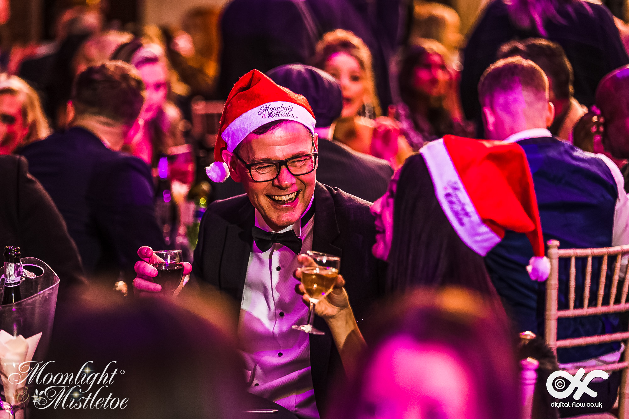 Guest enjoying dinner at a Moonlight & Mistletoe Christmas party night