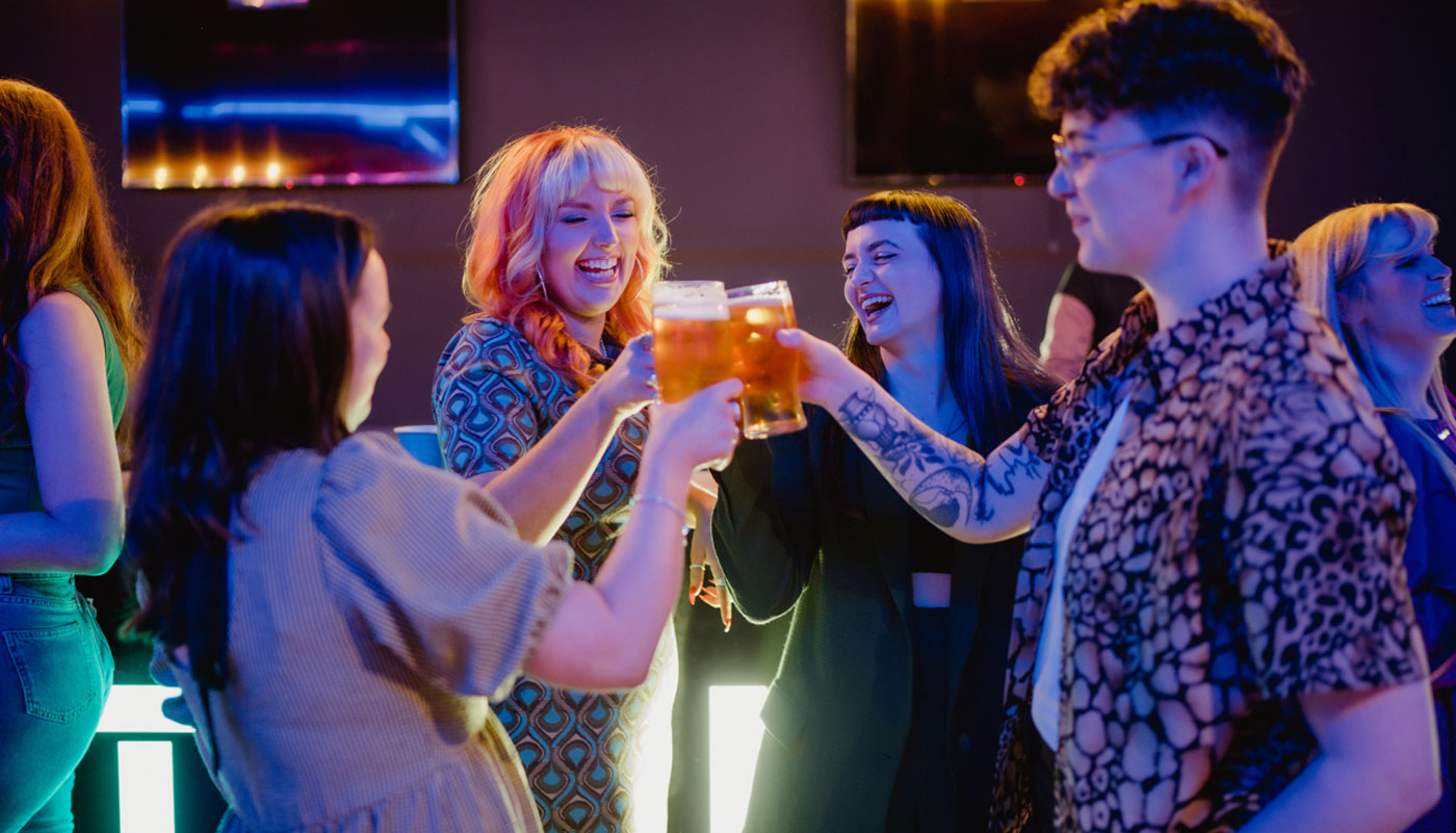 Work team enjoying drinks at BOOM Battle Bar Birmingham Christmas party