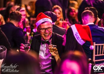 Guest enjoying dinner at a Moonlight & Mistletoe Christmas party night
