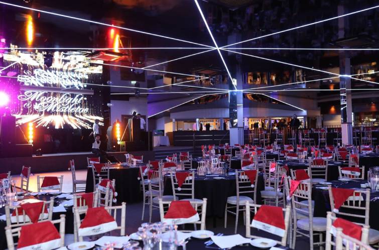 Stage and screen at the ICB Wolverhampton set up for a Moonlight & Mistletoe Christmas party